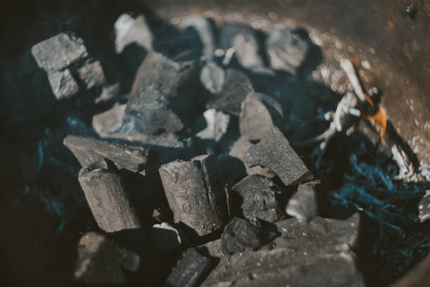 istock Macro Of Burning Charcoal And Smoke In Grill 1141920457