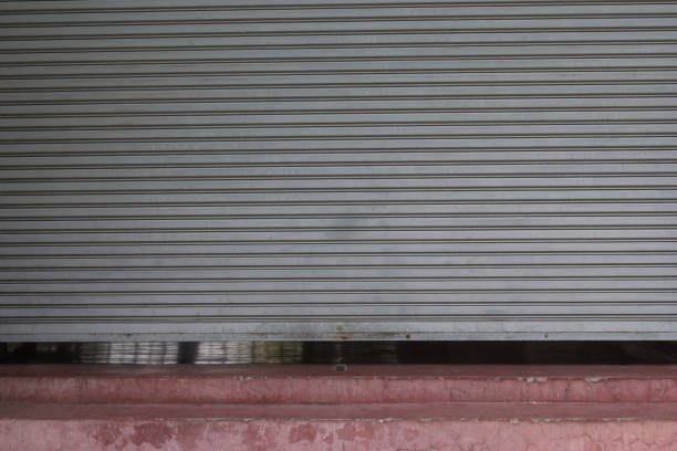 istock shutter metal rolling door in front of gym 1141921084