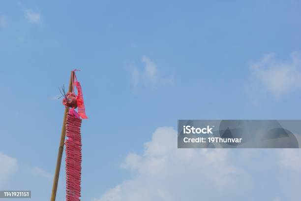 Red Firecrackers Hang On Pole With Blue Sky Stock Photo - Download Image Now - Asia, Blue, Celebration