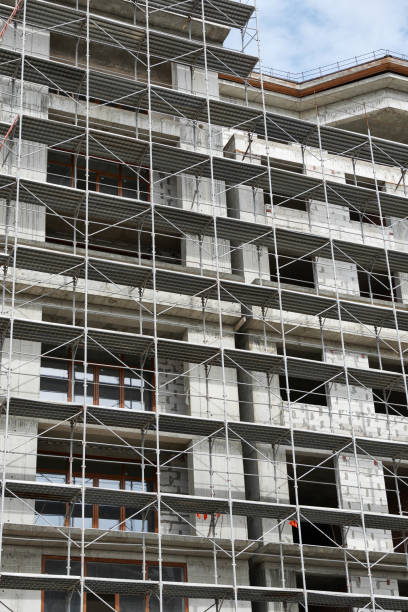 istock new building under construction, scaffolding and concrete 1141930807