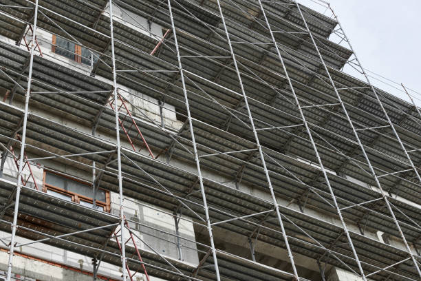 istock new building under construction, scaffolding and concrete 1141931665