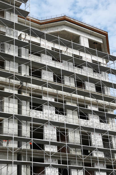 istock new building under construction, scaffolding and concrete 1141932912