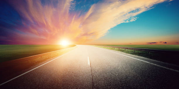 istock Panoramic road sunrise summer travel 1141933174