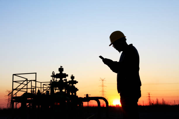 istock oil field, the oil workers are working 1141934919