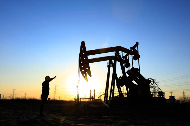 istock oil field, the oil workers are working 1141935147