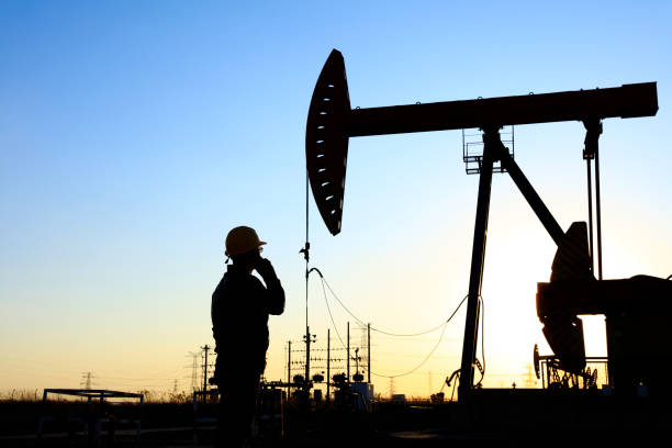 istock oil field, the oil workers are working 1141935156