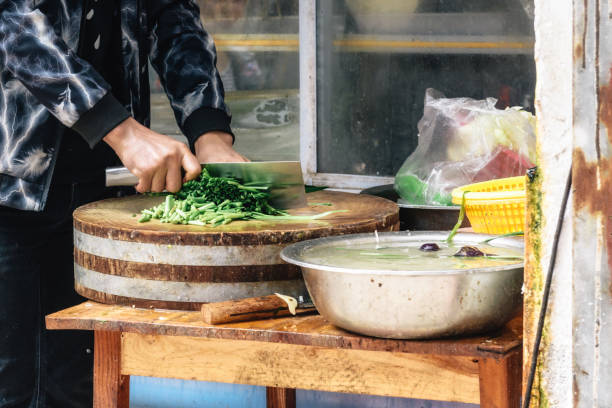 istock chinese man peparing meal on street 1141935541