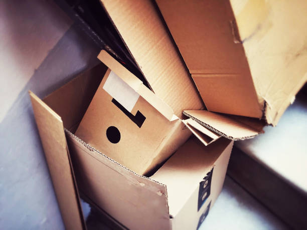 A group of open cardboard containers discarded