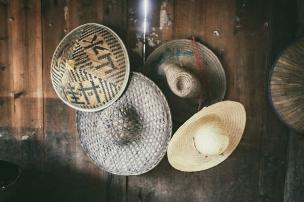 istock chinese straw hats on wooden wall 1141936454