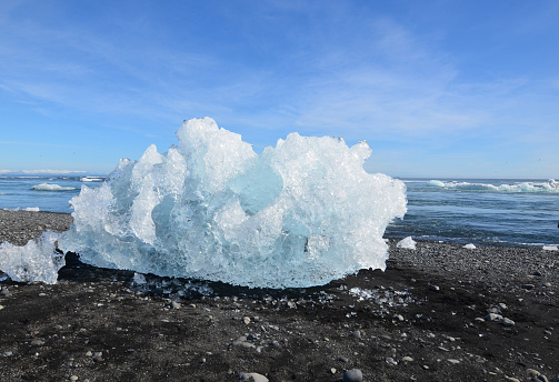 Chunk of an iceberg on the shore of a lagoon