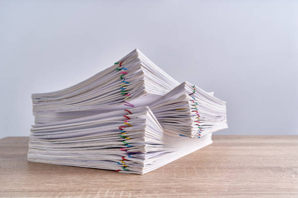 istock Pile overload paperwork report of receipt on wood table 1141938013