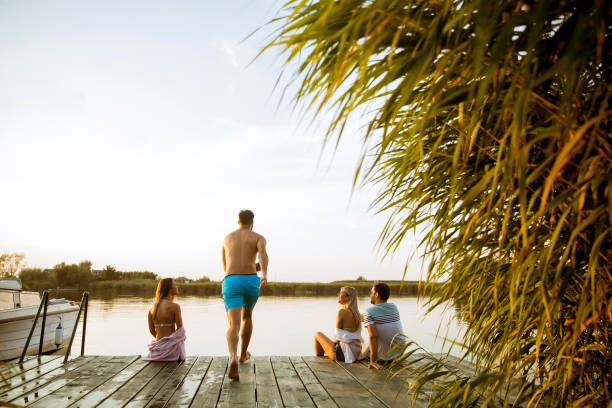 istock Young people having fun at the lake on a summer day 1141938933