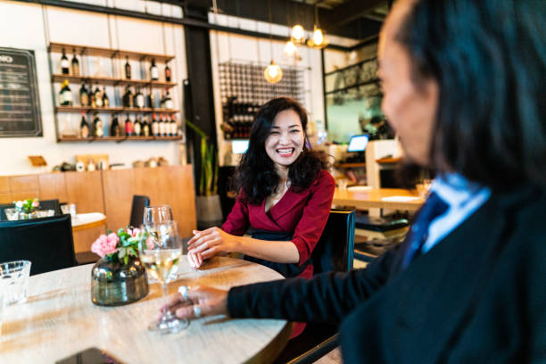 istock Chinese business people sitting in restaurant 1141938998