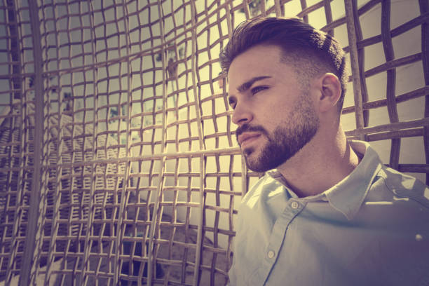 istock young beard man relaxed in a beach 1141942979