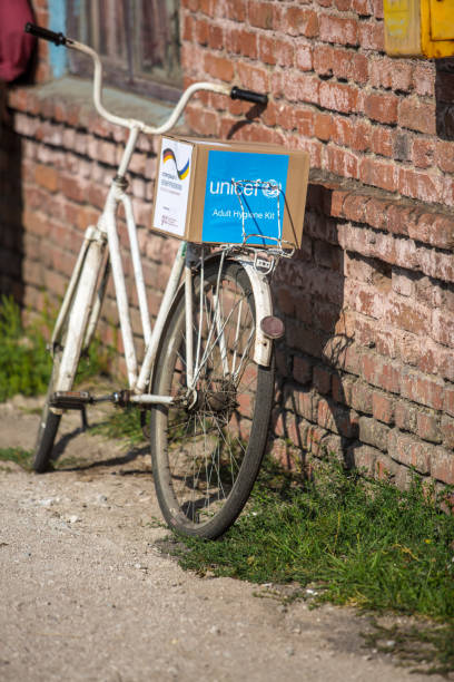 City bike of UNICEF volunteer Mariupol, Ukraine - June 25, 2016: City bike of UNICEF volunteer is on everyday work unicef stock pictures, royalty-free photos & images