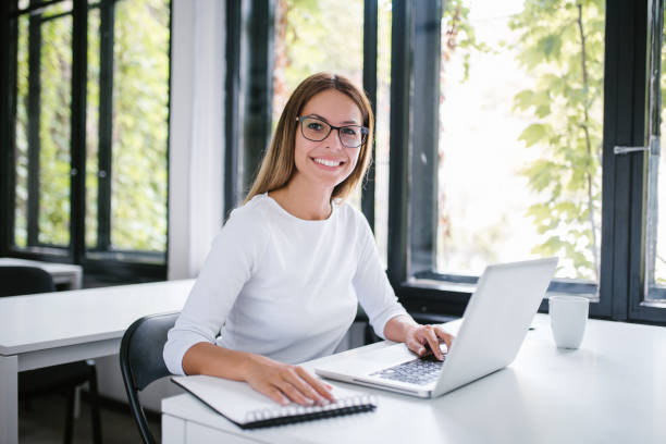 istock Portrait of cheerful student in a modern public library. 1141948234