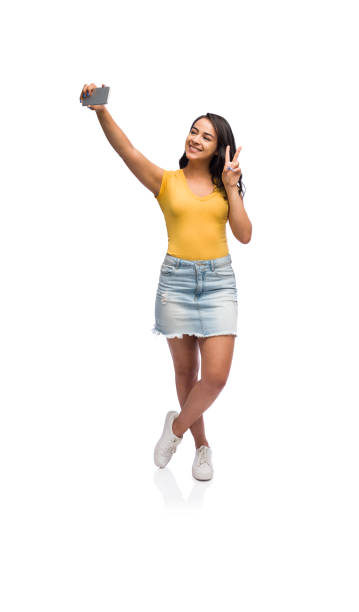istock Cheerful young woman taking a selfie 1141948274