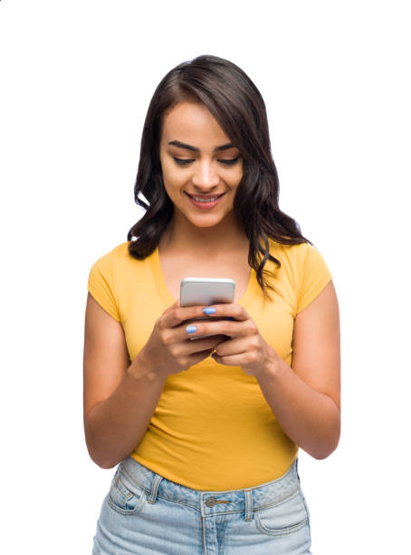istock Latin woman smiling and texting 1141948281