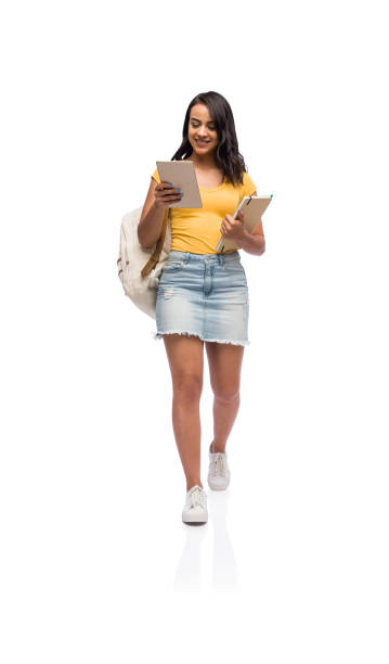 istock A female student walking and looking at a tablet 1141948303