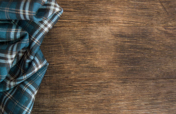 istock Wooden table with checkered napkin 1141953572