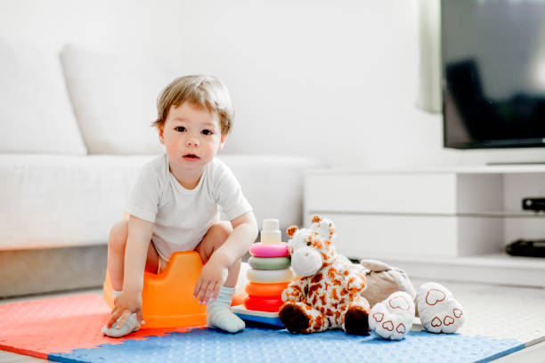 istock Baby  sitting on potty 1141957465