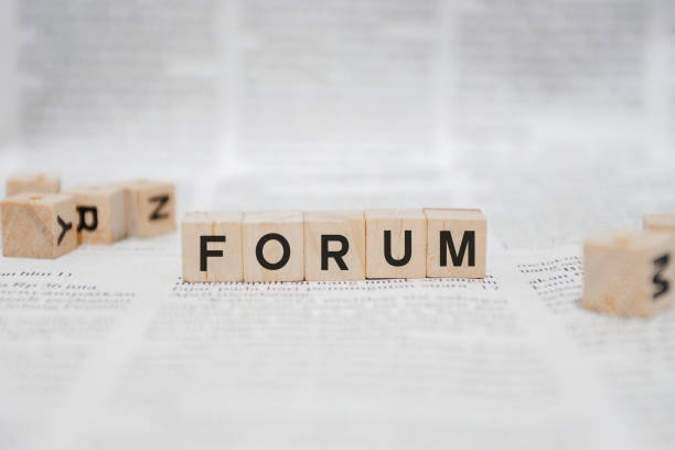 istock Forum Word Written In Wooden Cube - Newspaper 1141959175