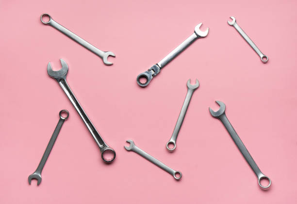 istock A few wrenches on a pink background. 1141961124