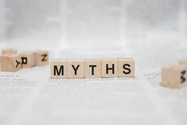 Myths Word Written In Wooden Cube - Newspaper
