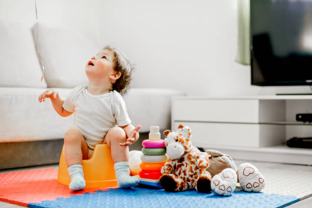 istock Baby  sitting on potty 1141962109