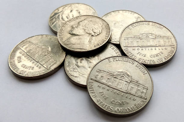 American 5 cent coins usa on white background Close up American 5 cent coins usa on white background five cent coin stock pictures, royalty-free photos & images