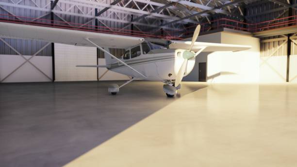 istock Hangar for aircraft with airplane at sunny summer day. 3D Rendering 1141966681
