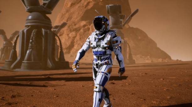istock Astronaut goes on the surface of Mars through a dust storm past the giant solar panels. Panoramic landscape on the surface of Mars. 3D Rendering 1141966706