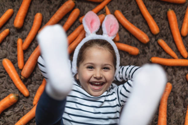 istock Bunny-eared girl playing on easter morning 1141968347