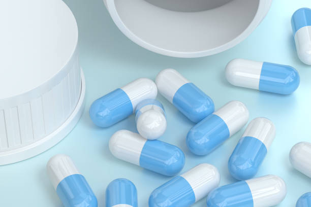 istock 3d rendering, white medicine bottle with capsules 1141968626