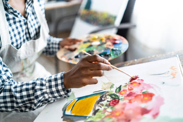 istock Female artist working in studio 1141968771