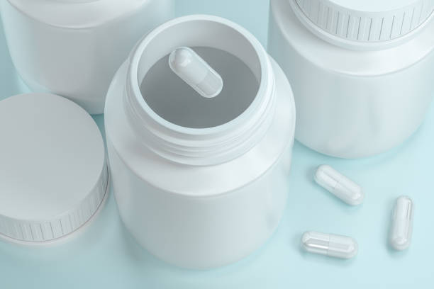 istock 3d rendering, white medicine bottle with capsules 1141969099