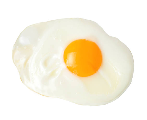 istock Fried appetizing egg on white isolated background. Close-up. View from above. 1141969443