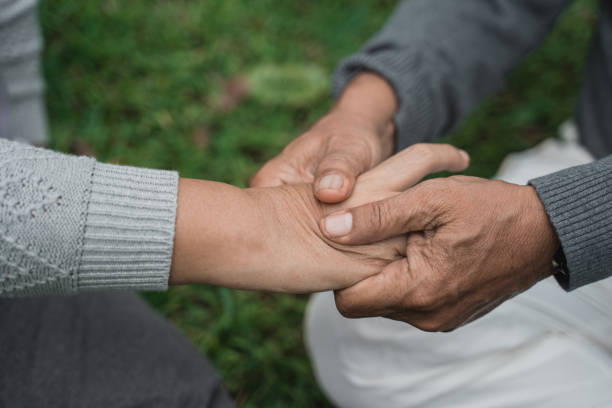 istock senior  hand massaging on someone's palm 1141971073