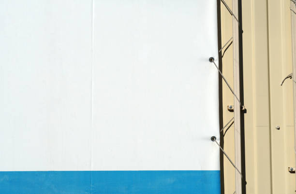 istock Fragment empty street banner with fastener elements. Poster edge on metal wall 1141972440