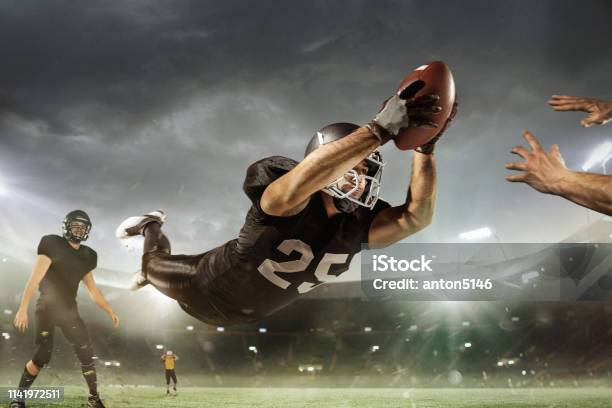 American Football Sportsman Player On Stadium Running In Action Sport  Wallpaper With Copyspace Stock Photo - Download Image Now - iStock