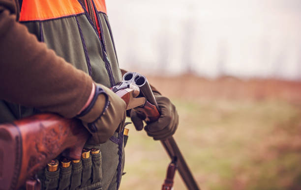 istock Hunter with a rifle in hunting 1141975830