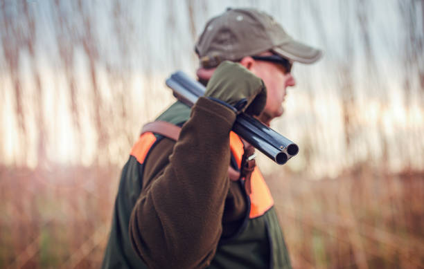 istock Hunter with a rifle in hunting 1141975879