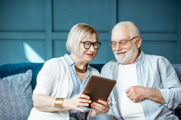 istock Senior couple with tablet at home 1141976783
