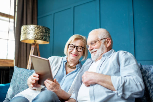 istock Senior couple with tablet at home 1141976826
