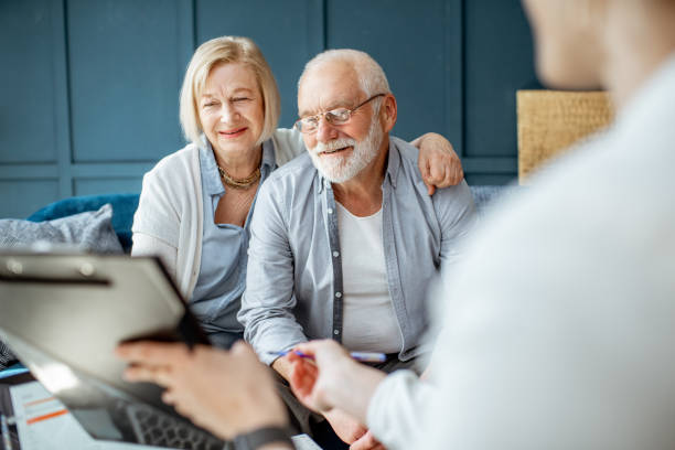 istock Senior couple with consultant at the office 1141977875