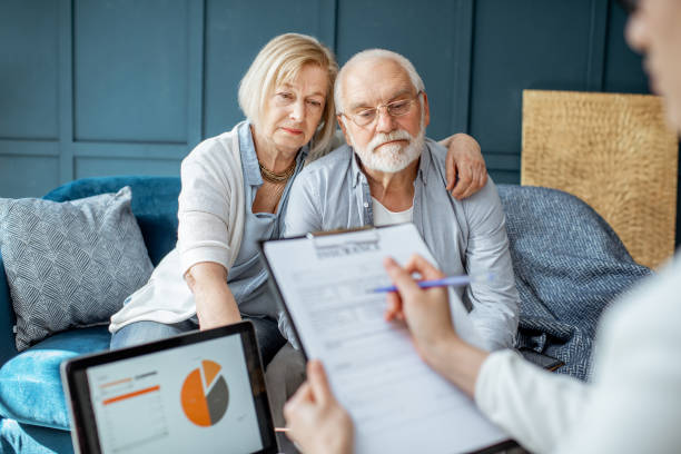 istock Senior couple with consultant at the office 1141977920