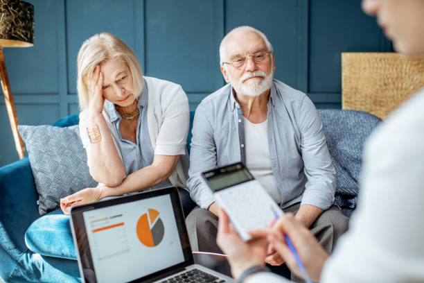 istock Senior couple with consultant at the office 1141977947