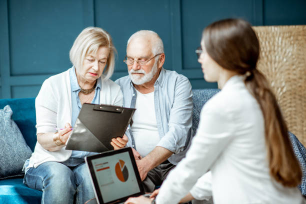 istock Senior couple with consultant at the office 1141977956
