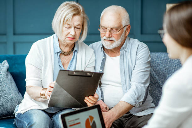 istock Senior couple with consultant at the office 1141978008