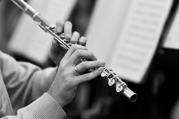 istock Hands musician playing the flute closeup 1141978017